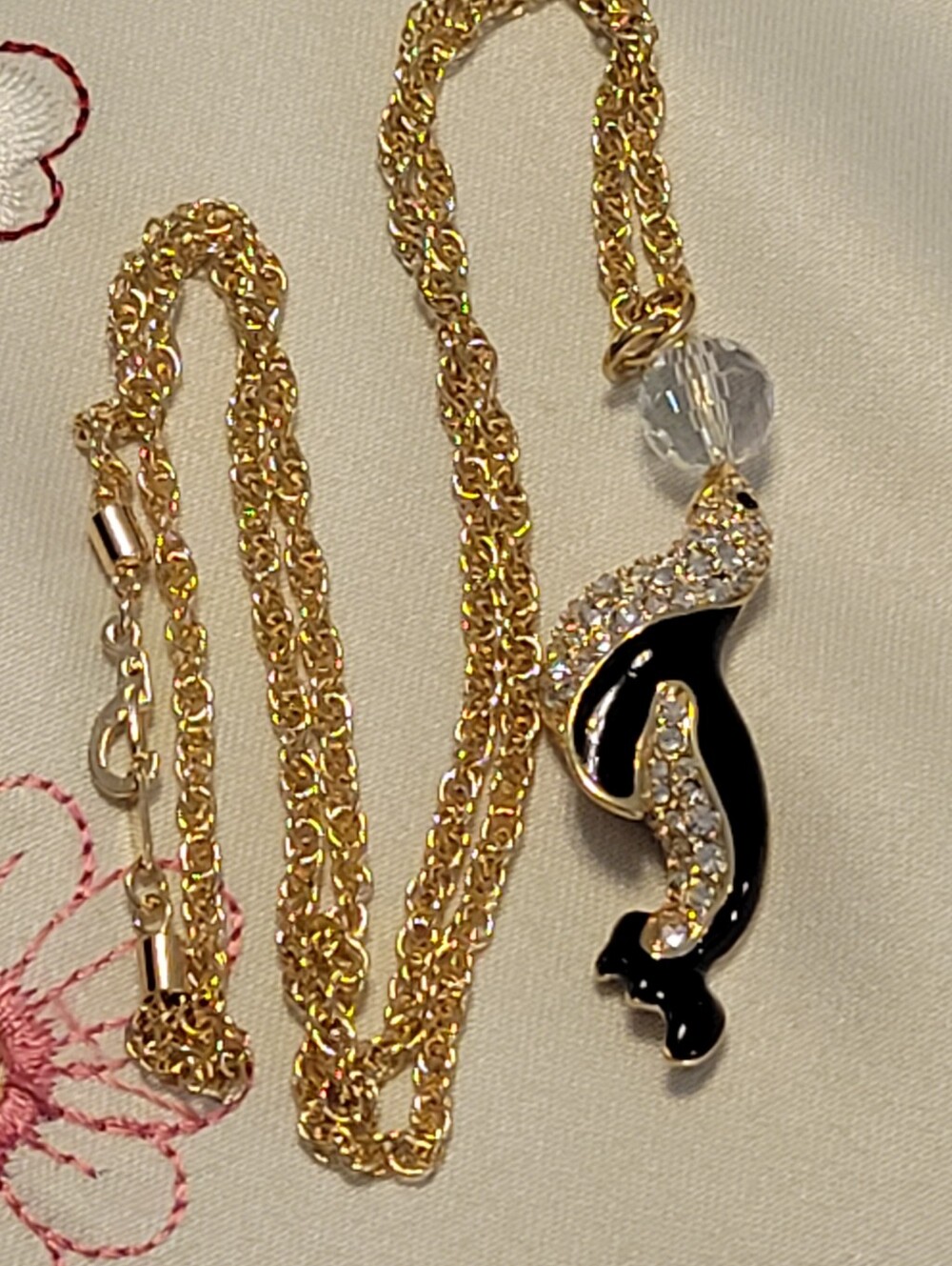 Vintege signed Swarovski Seal with a Feceted Crystal Ball On The Nose.22" Long